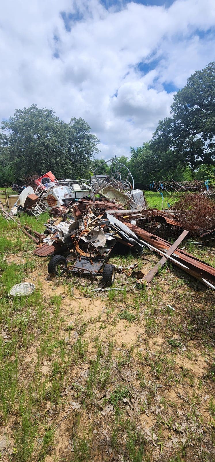 Rusted scrap and equipment — before